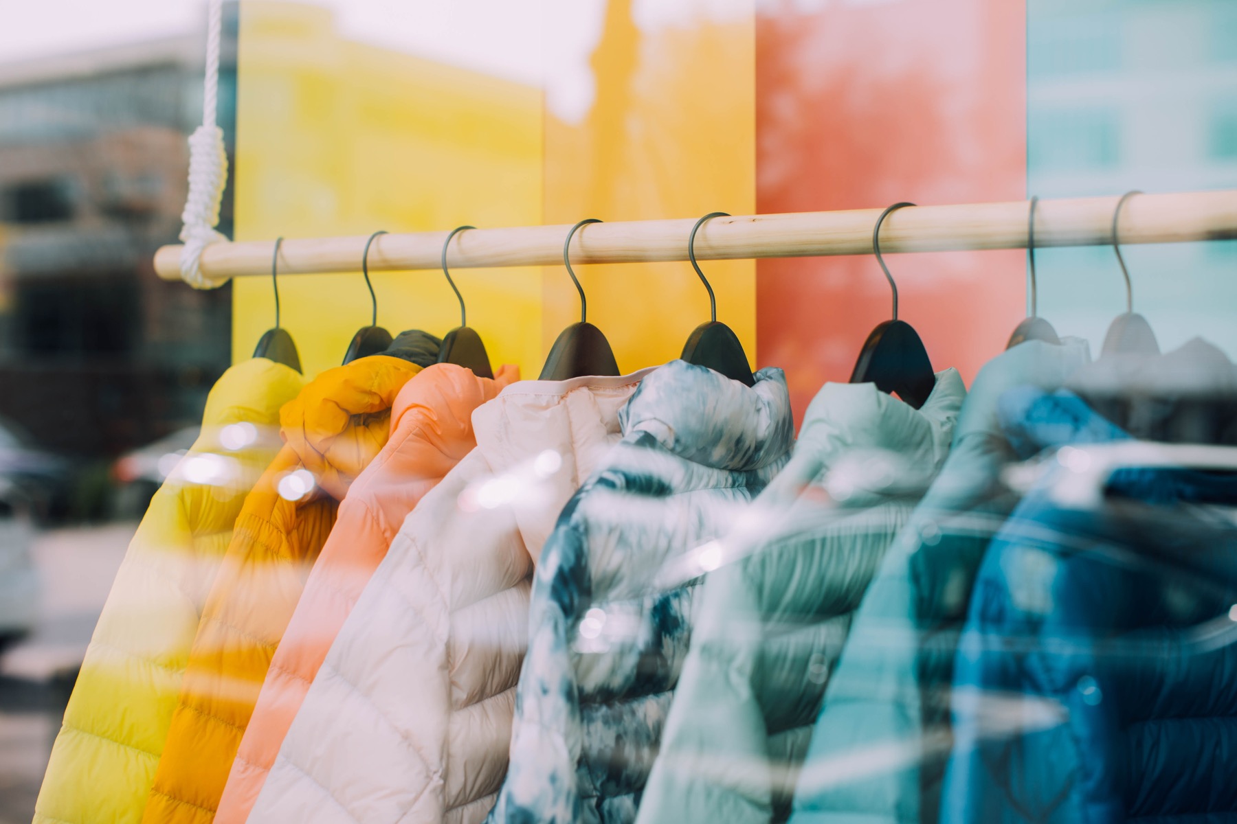 A storefront rack of colorful clothing